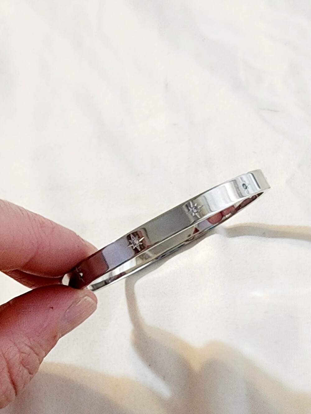Polished Silver Star-Engraved Womens Bangle Bracelet